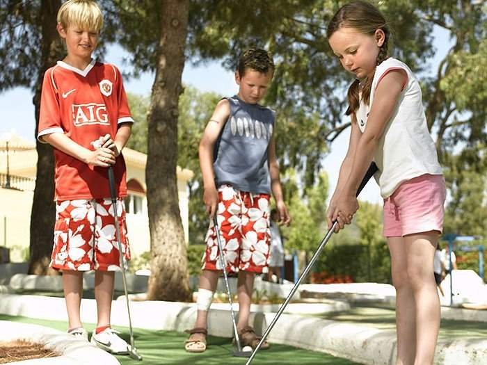 Enjoying mini golf at our La Manga Club apartments for sale