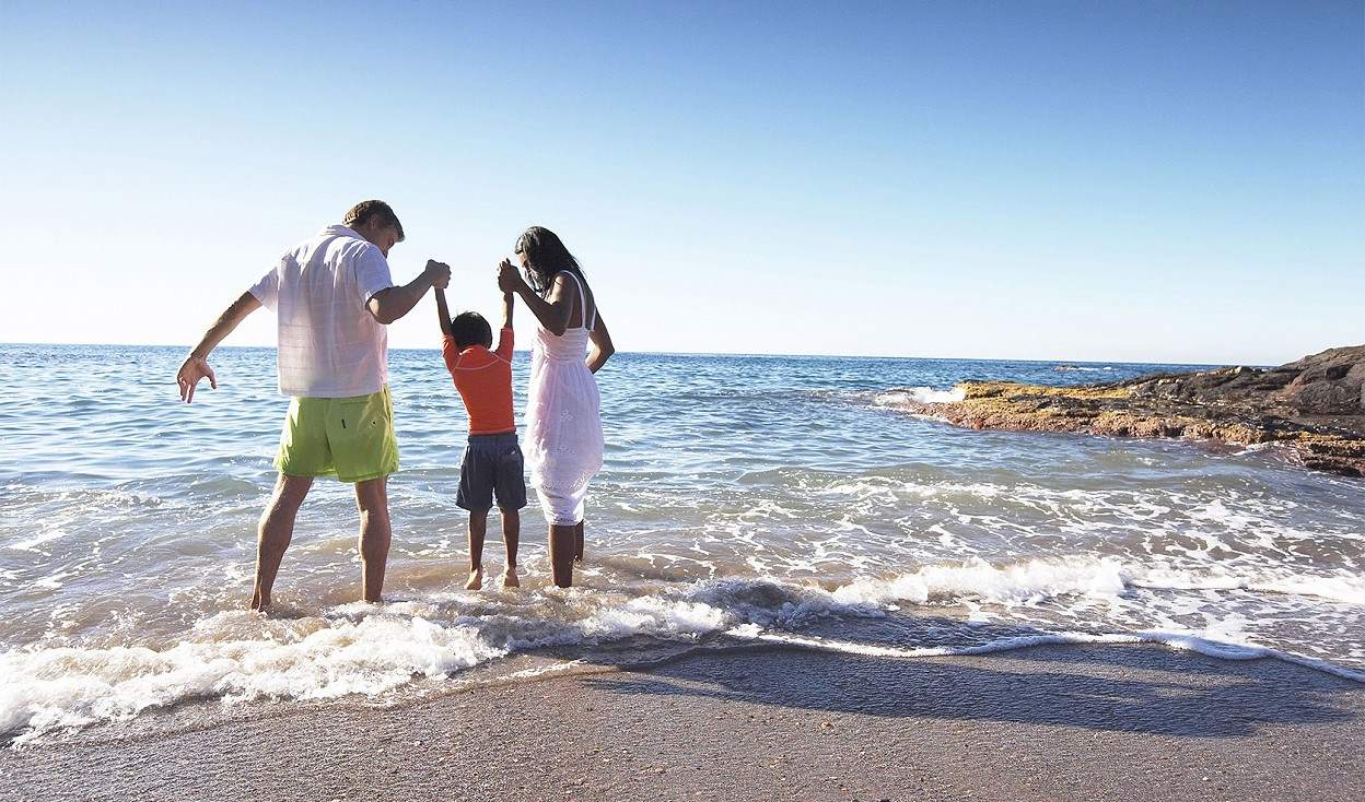Family on the beach at La Manga Club